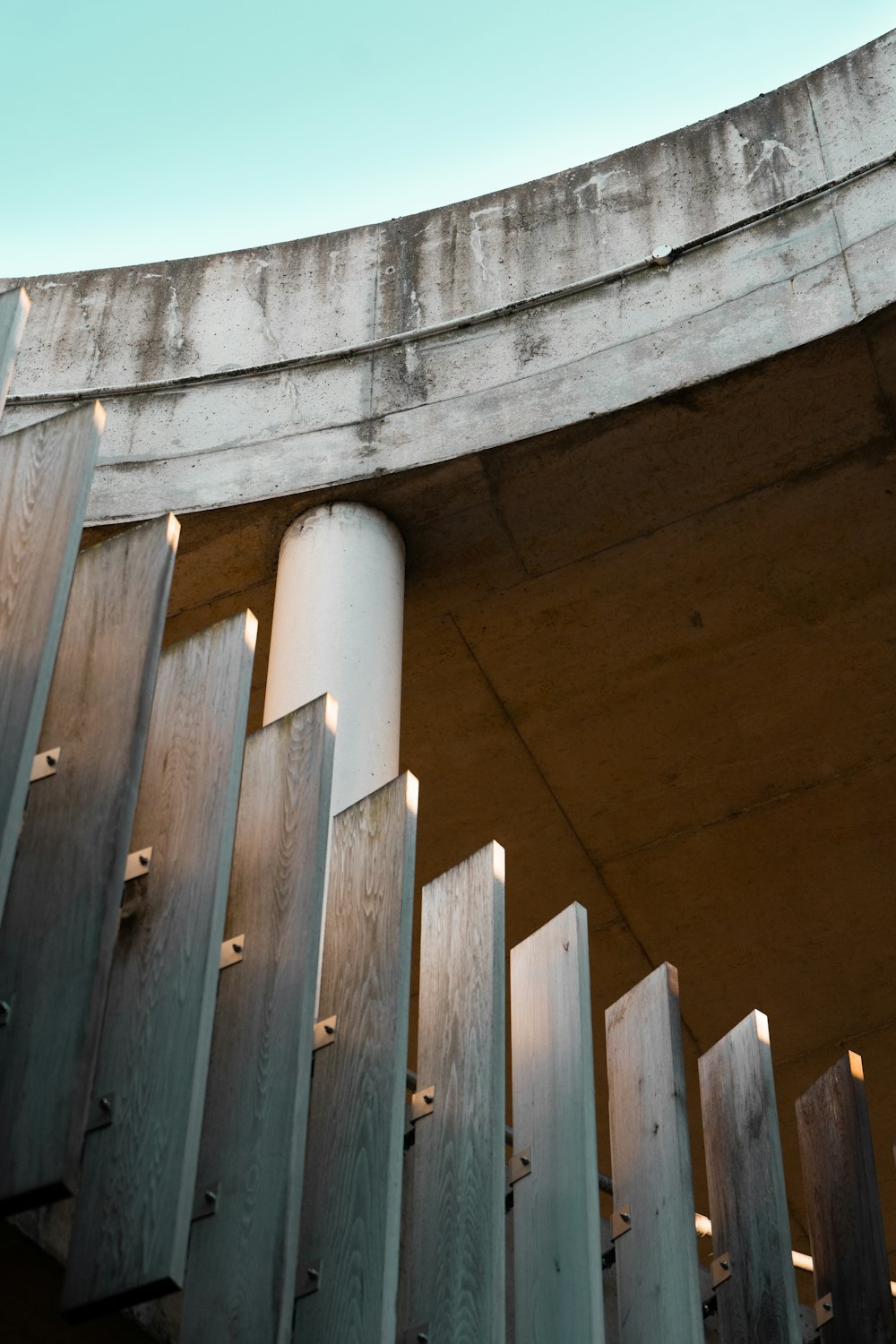 a close up of a metal structure with a sky in the background