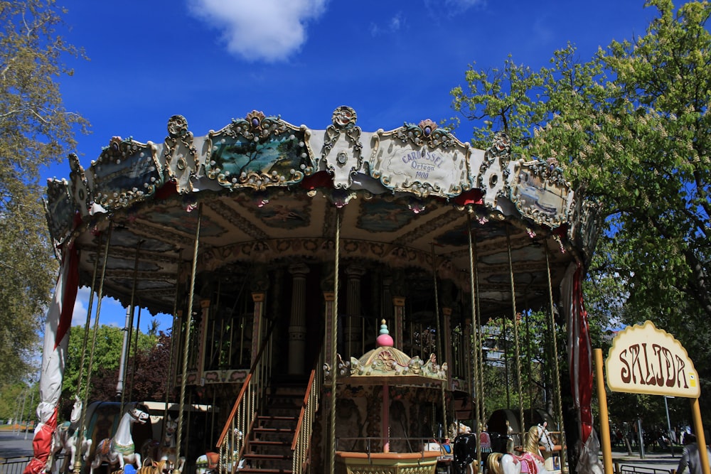 a merry go round with people walking around it