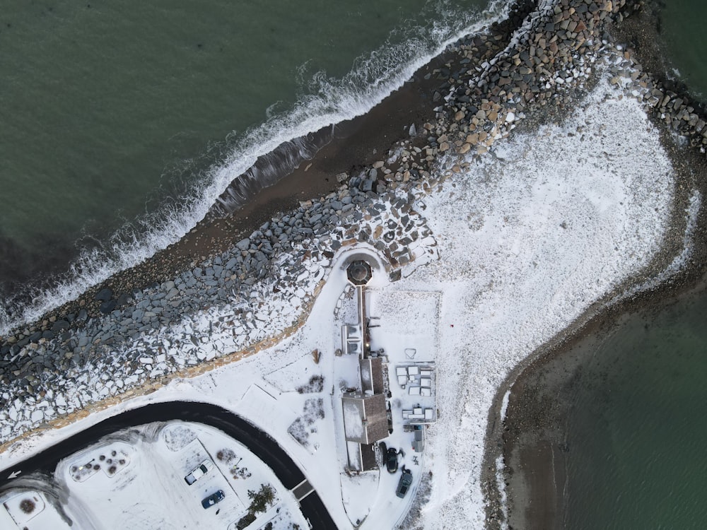 an aerial view of a snow covered beach