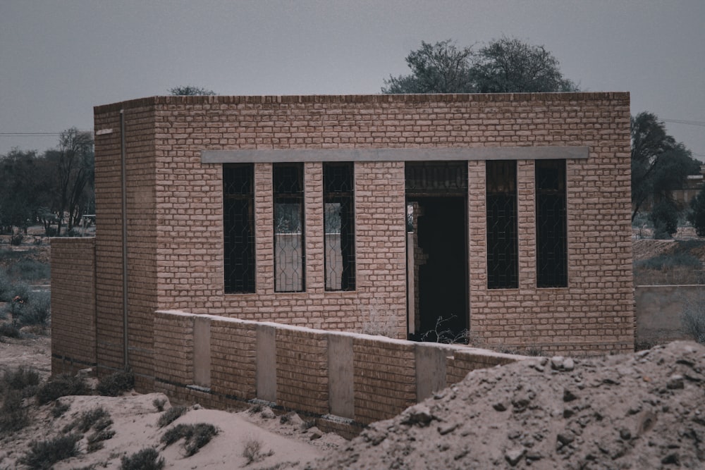 a brick building with windows and a door