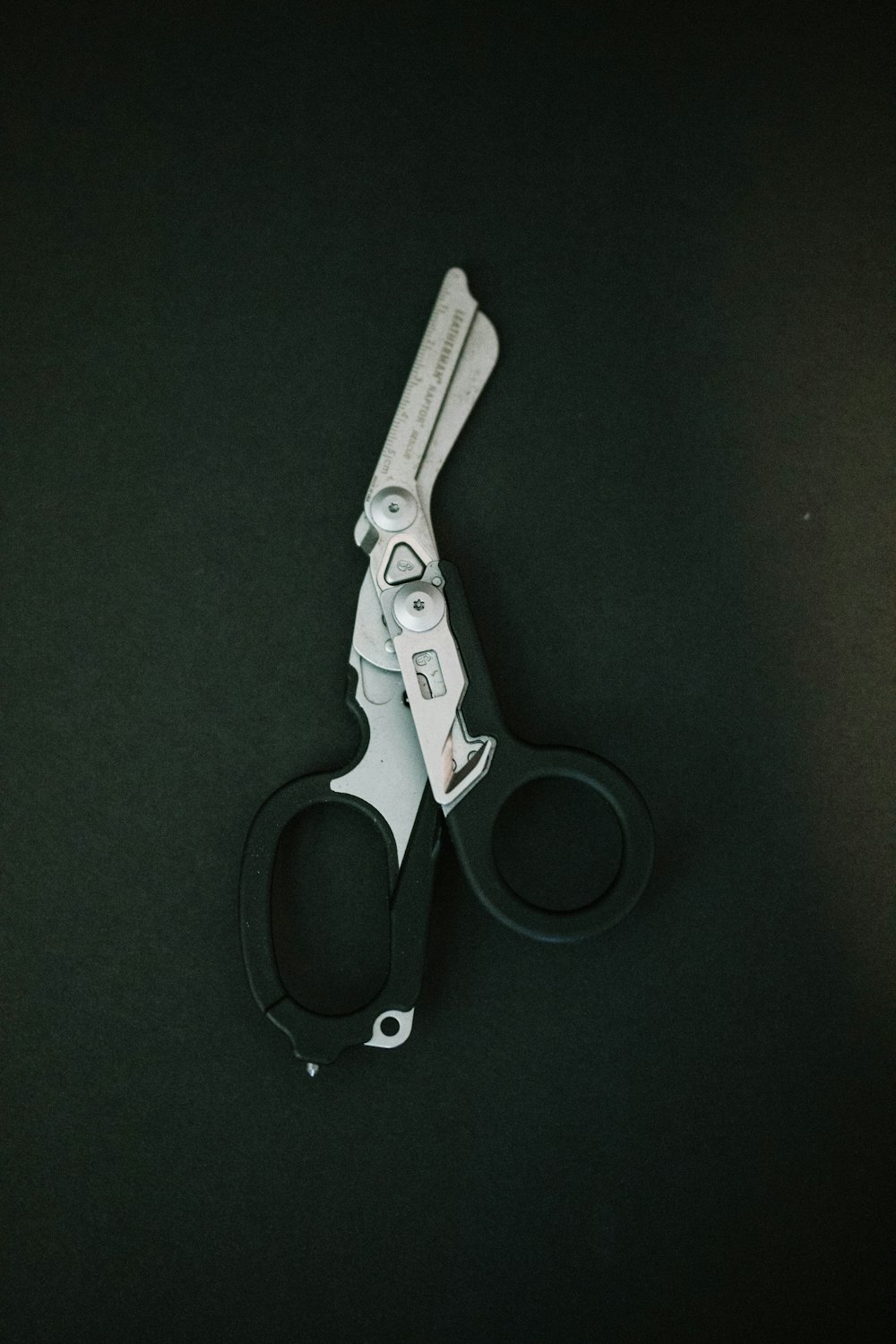 a pair of scissors sitting on top of a table