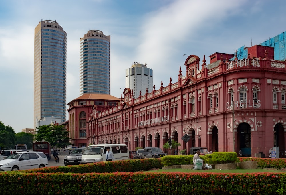 a large red building with a clock on the top of it