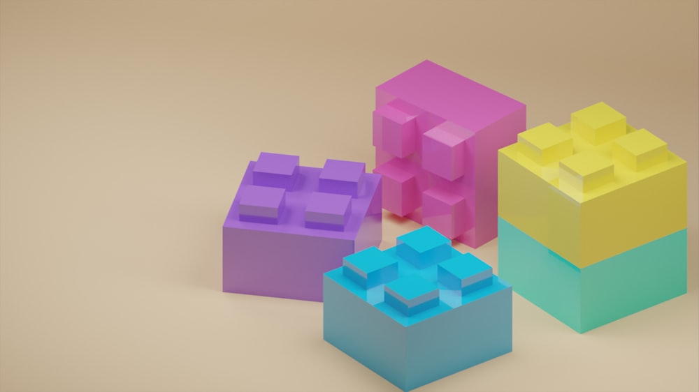 a group of three lego blocks sitting next to each other