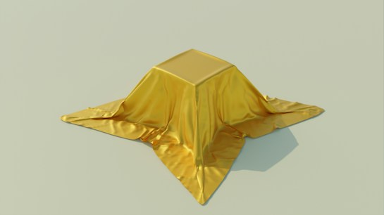 A smooth, shiny golden fabric draped over a square object, creating soft folds and shadows. The background is a plain, light beige color, providing a minimalist and elegant contrast.