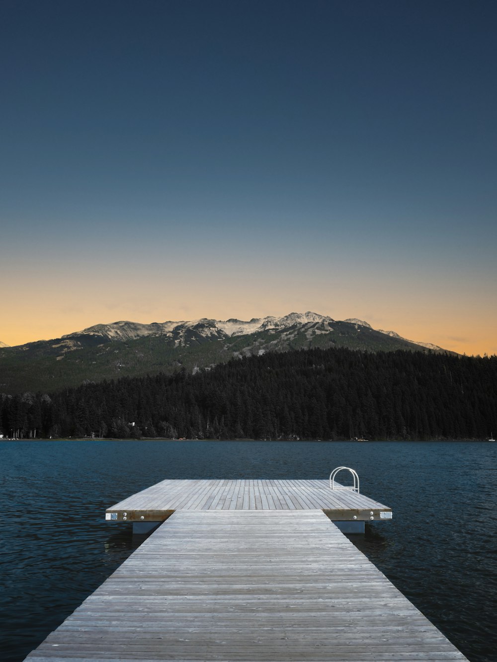 a wooden dock sitting on top of a body of water