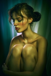 A serene image of a woman meditating surrounded by soft glowing lights symbolizing spiritual guidance.