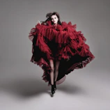 Evening wear ensemble with dramatic ruffles and bold color contrasts.