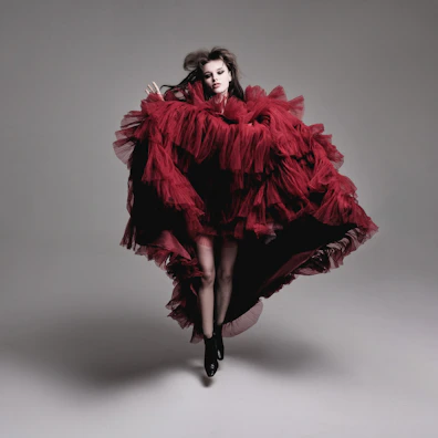 Evening wear ensemble with dramatic ruffles and bold color contrasts.