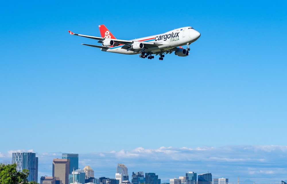 a large jetliner flying through a blue sky