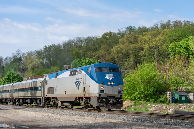 Illustrative travel and business imagery accompanying Amtrak Scenic Rail Vacation Planning