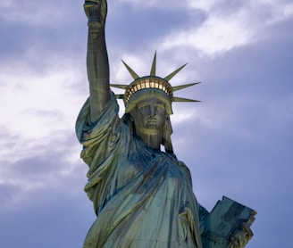 the statue of liberty is holding a torch in its hand