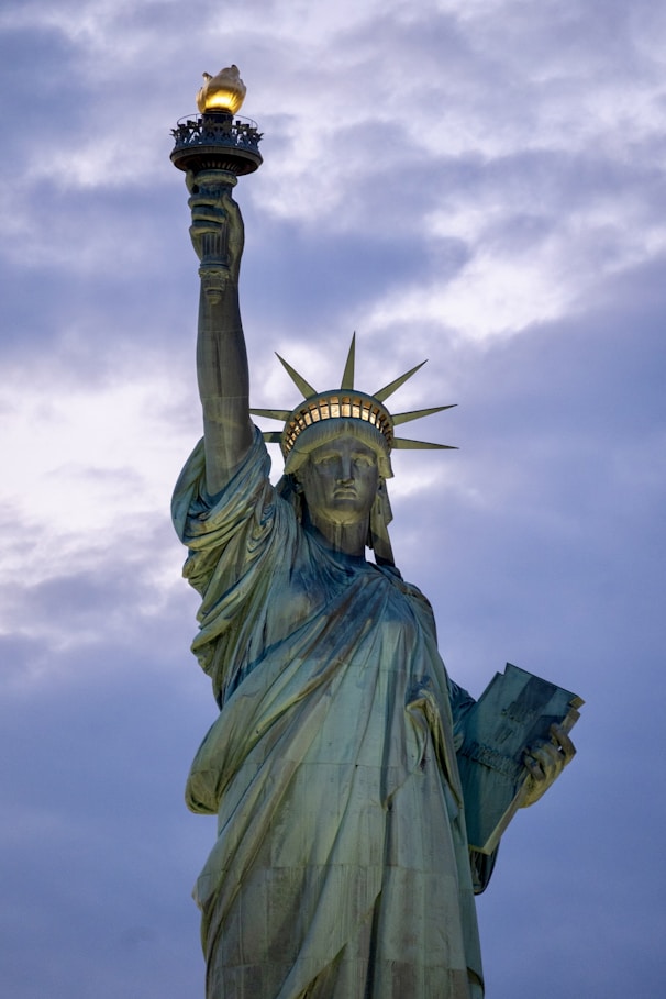 the statue of liberty is holding a torch in its hand