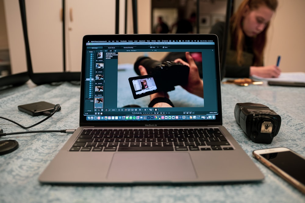 a laptop computer sitting on top of a table