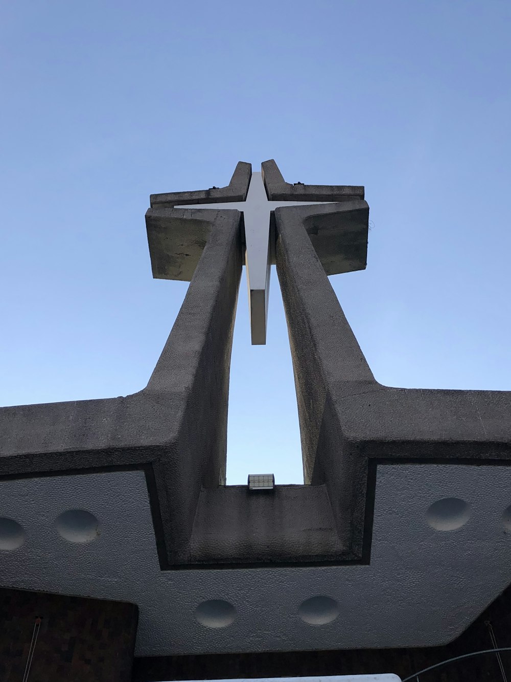 a large cross on top of a building