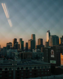 A sleek cityscape of Hyderabad highlighting residential and commercial buildings at dusk.