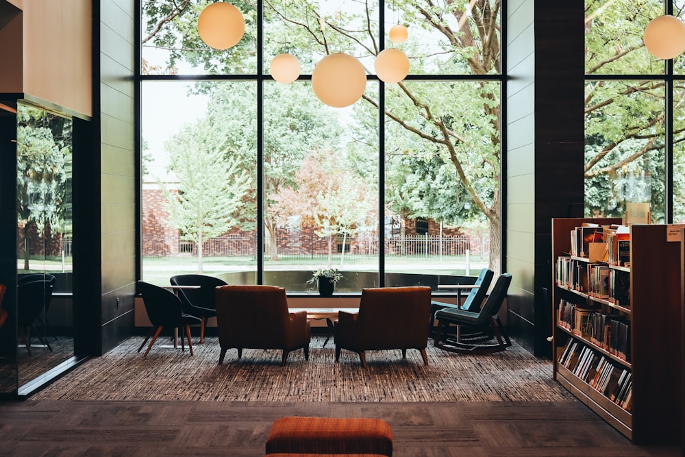 a library filled with lots of books and furniture