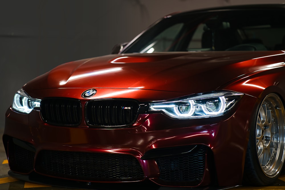 a red car is parked in a garage