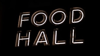 a neon sign that reads food hall