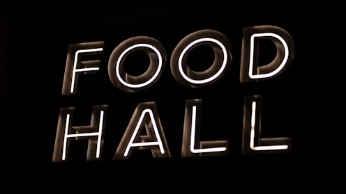 a neon sign that reads food hall