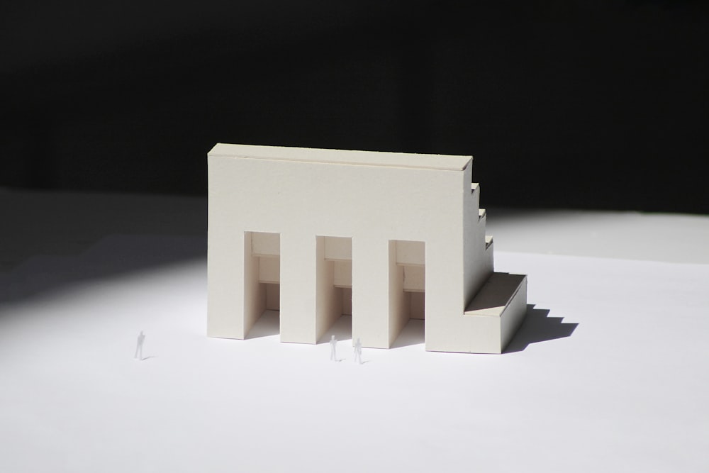 a model of a building on a white surface