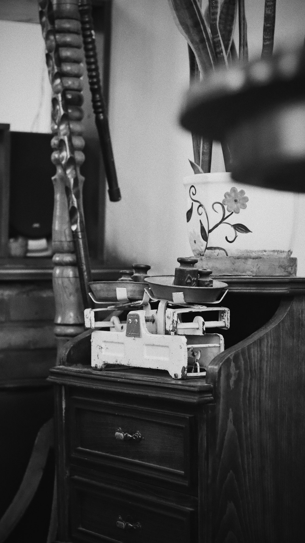 a black and white photo of a desk and chair