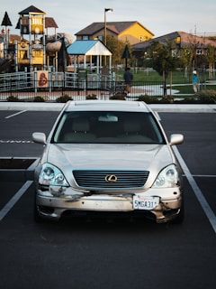 a silver car parked in a parking lot