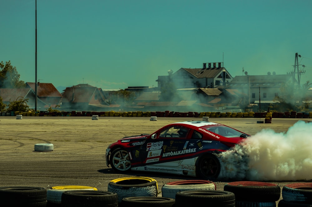 a red car with smoke coming out of it