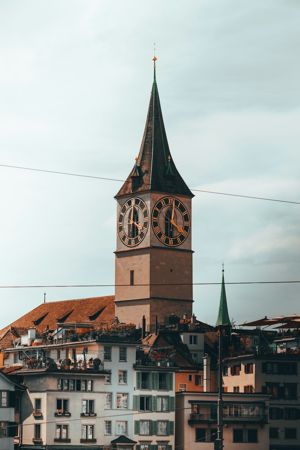 a tall clock tower towering over a city