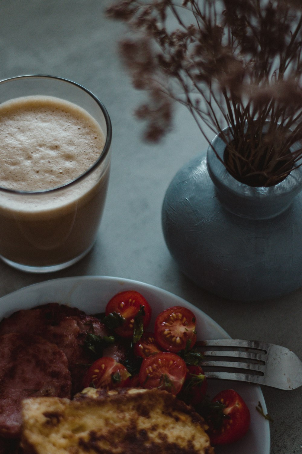 a plate of food next to a glass of milk