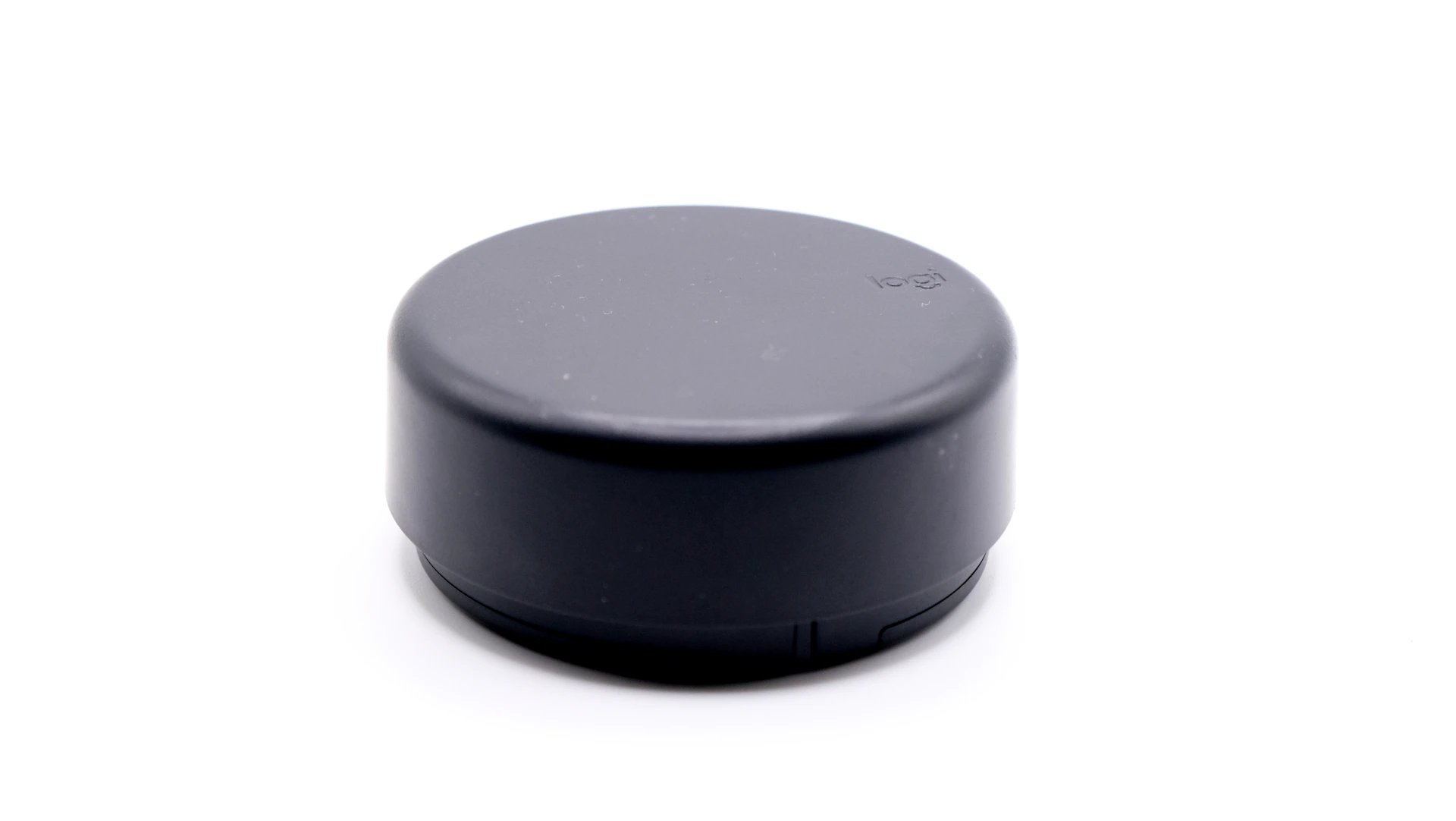 a close up of a black object on a white surface