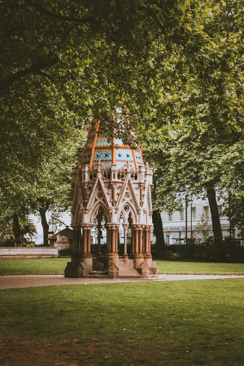 a clock tower in the middle of a park