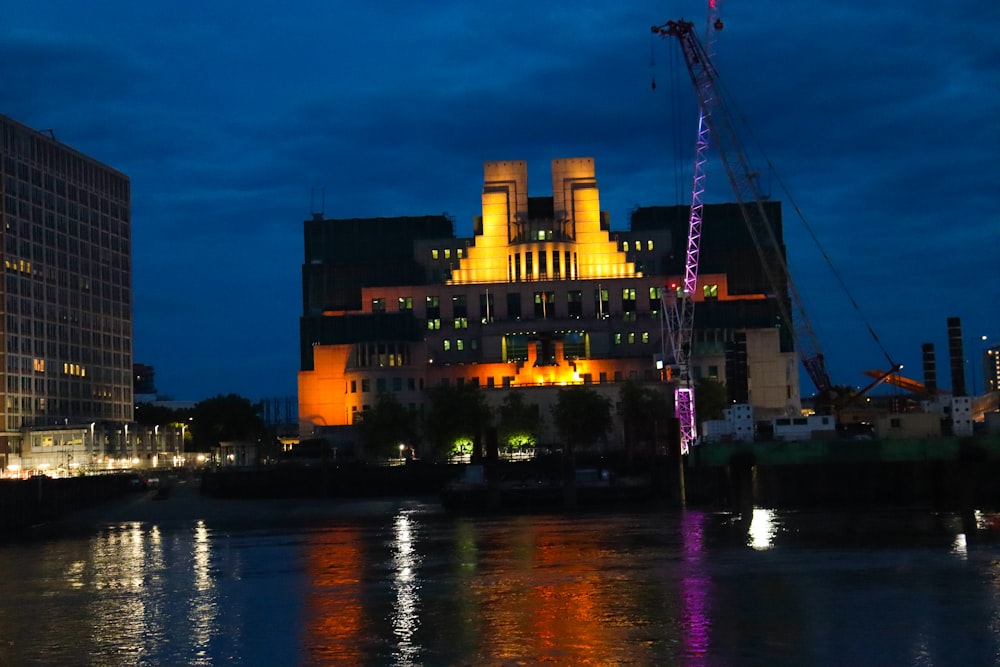 a large building sitting next to a body of water