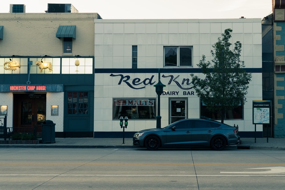 a car parked in front of a hair salon