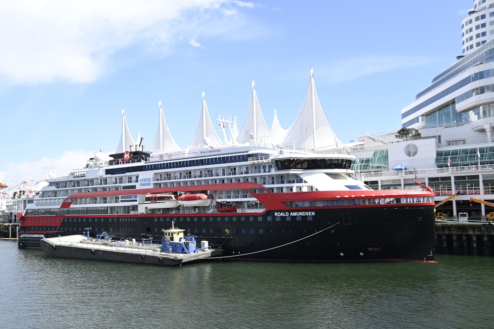 a large cruise ship docked in a harbor