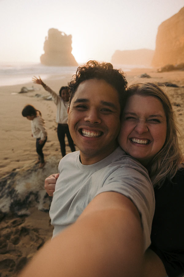 Couple smiling and enjoying the beach in Sydney