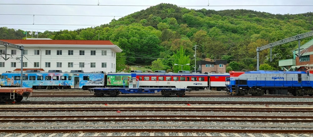 a train yard with several trains on the tracks