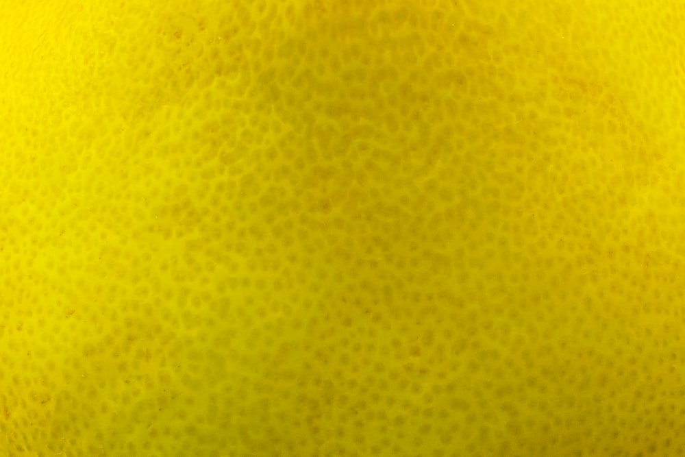 a close up view of a yellow fruit