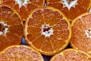 a bunch of oranges that are cut in half