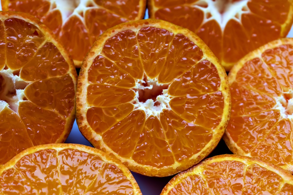 a bunch of oranges that are cut in half