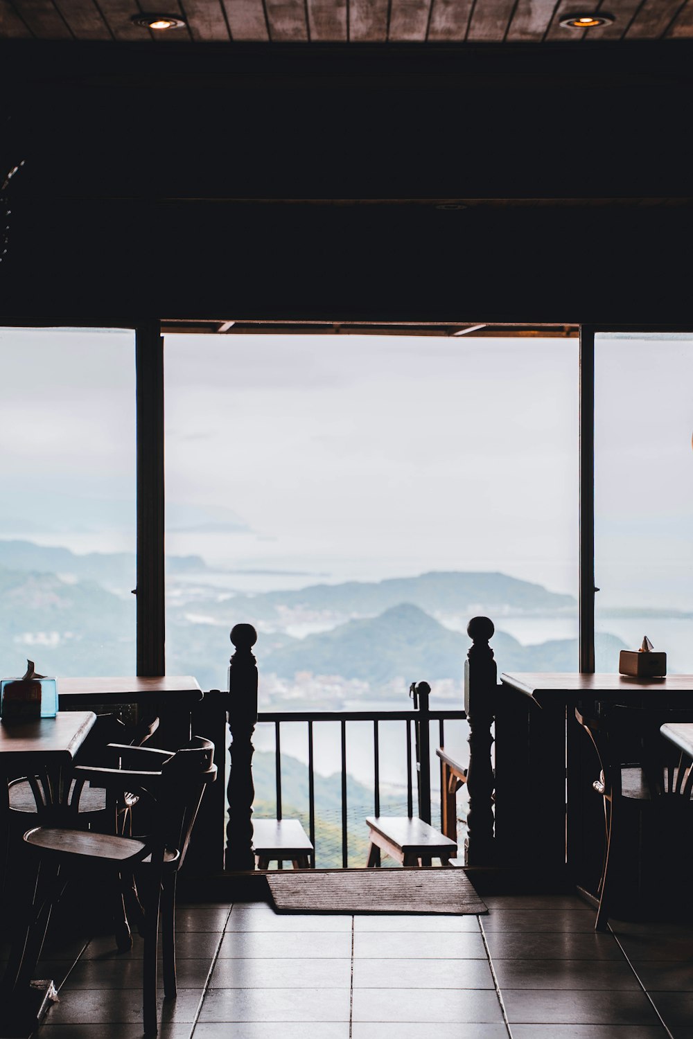 a restaurant with a view of the mountains