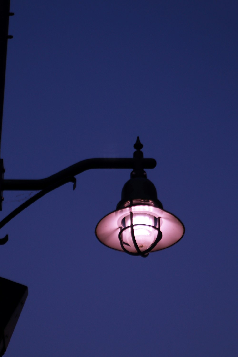 a street light with a blue sky in the background