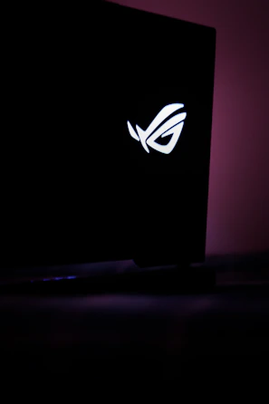 A vibrant ASUS logo shining on a gaming monitor.