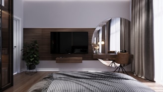 a bedroom with a large mirror and a bed