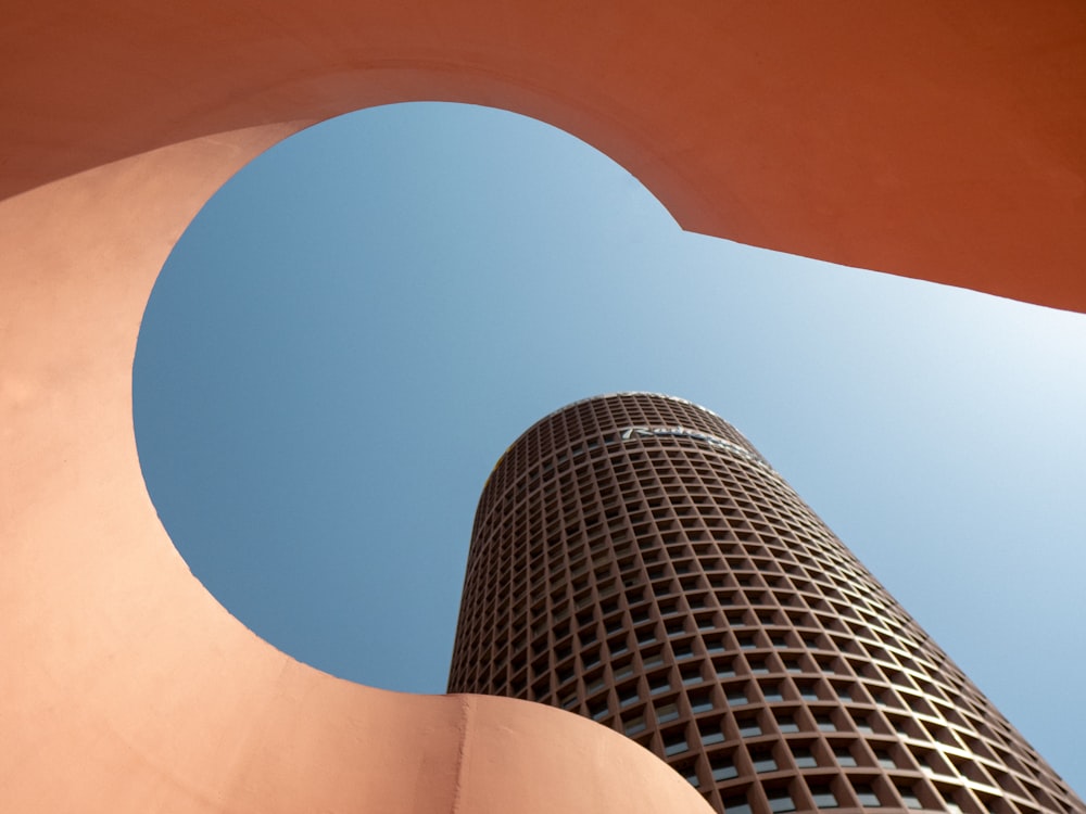 a very tall building with a sky background