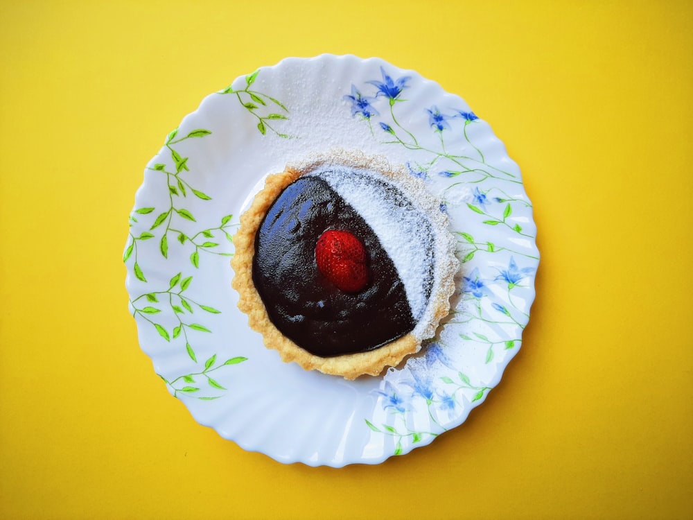 a dessert on a plate on a yellow background