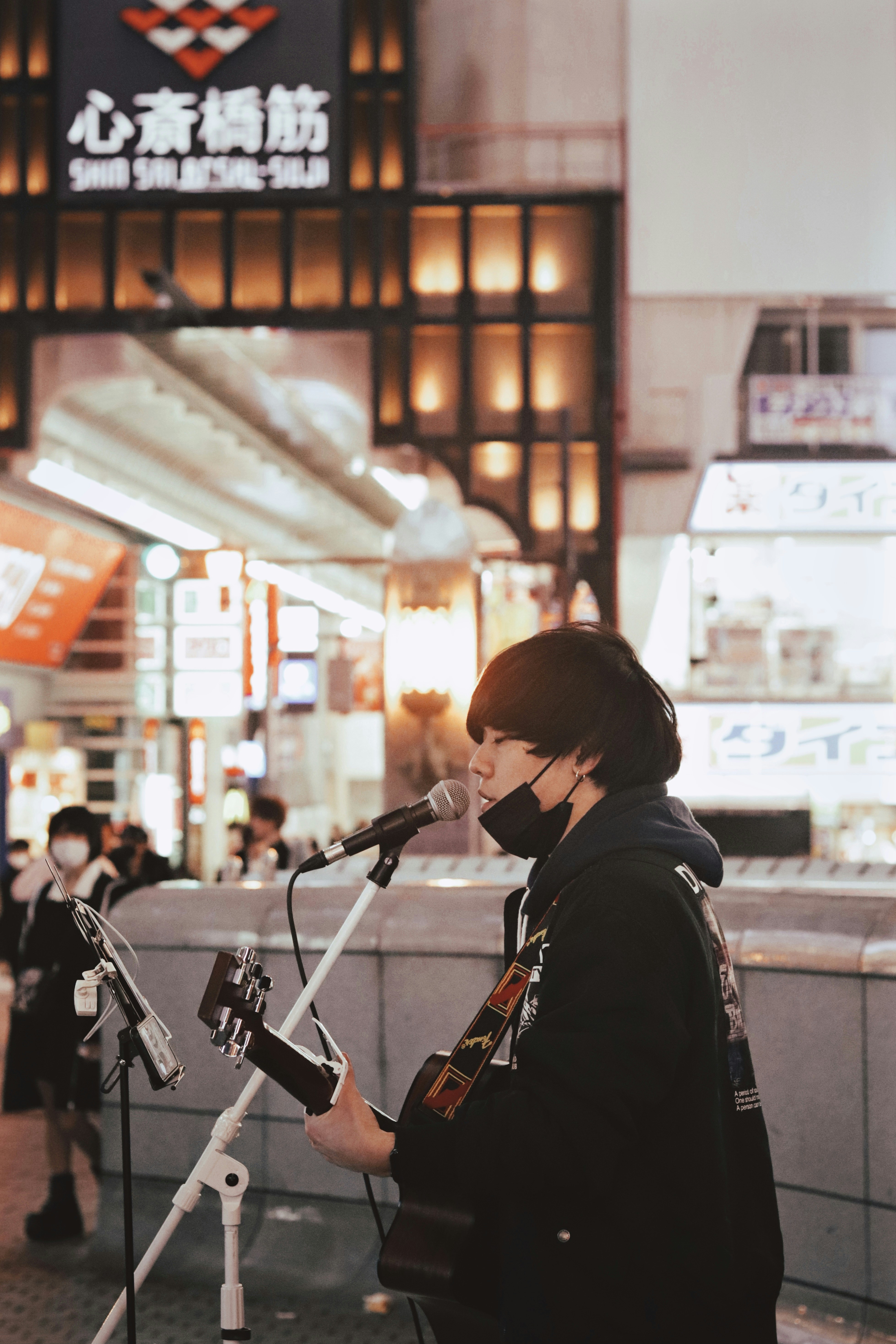 a woman standing in front of a microphone