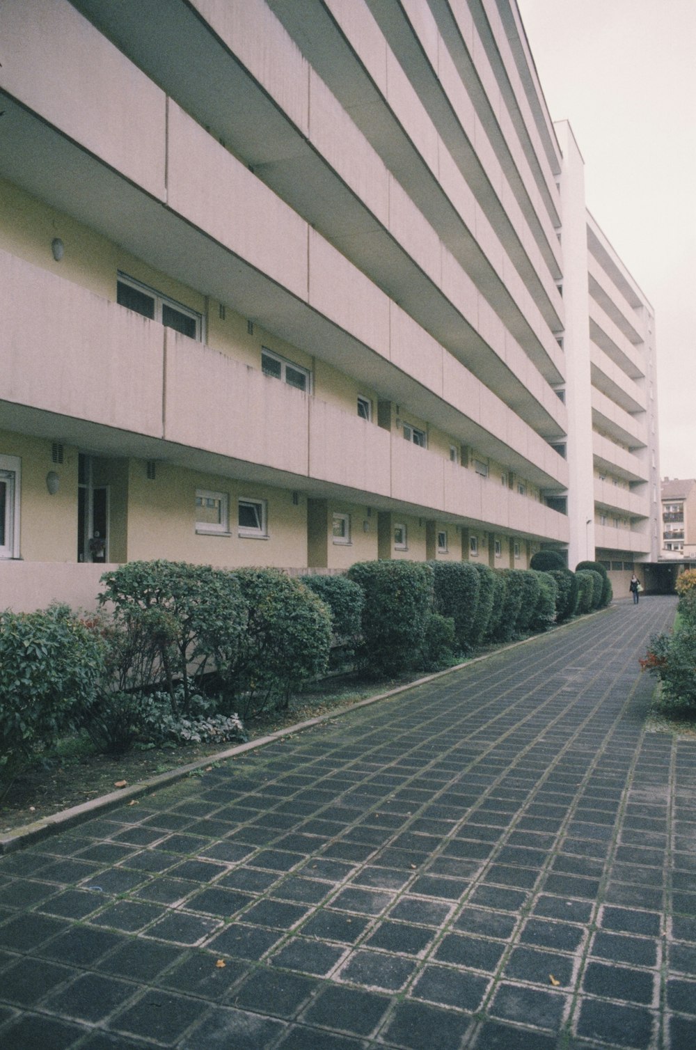 a building that has a brick walkway in front of it