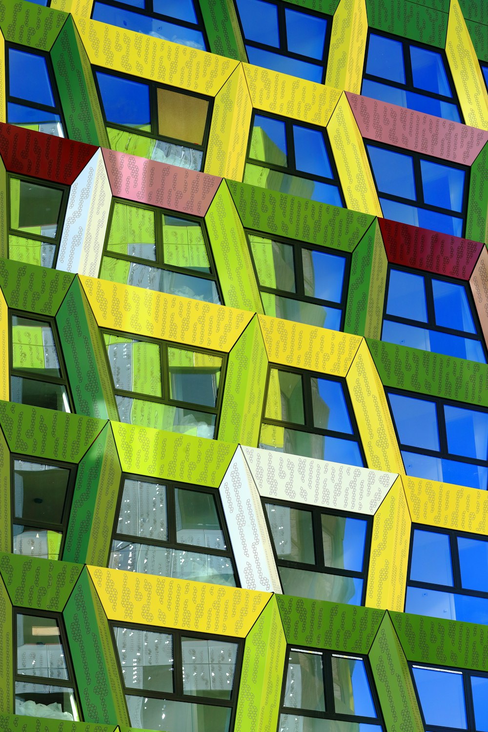 a multicolored building with many windows