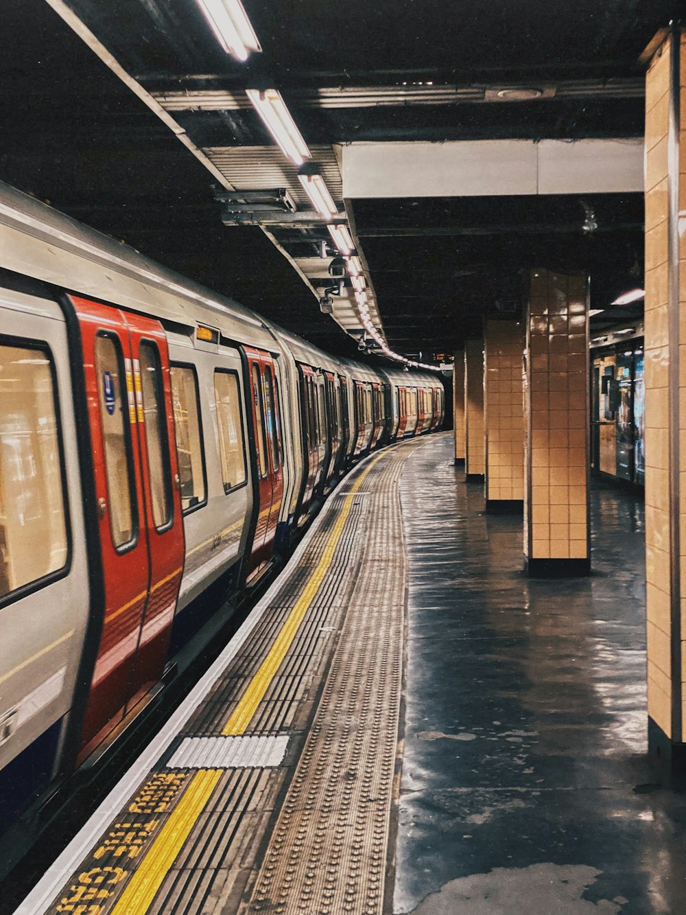 a subway train pulling into a train station