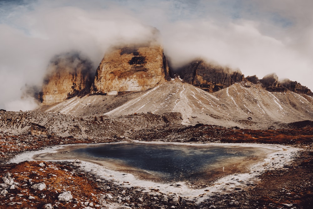 a mountain with a lake in the middle of it